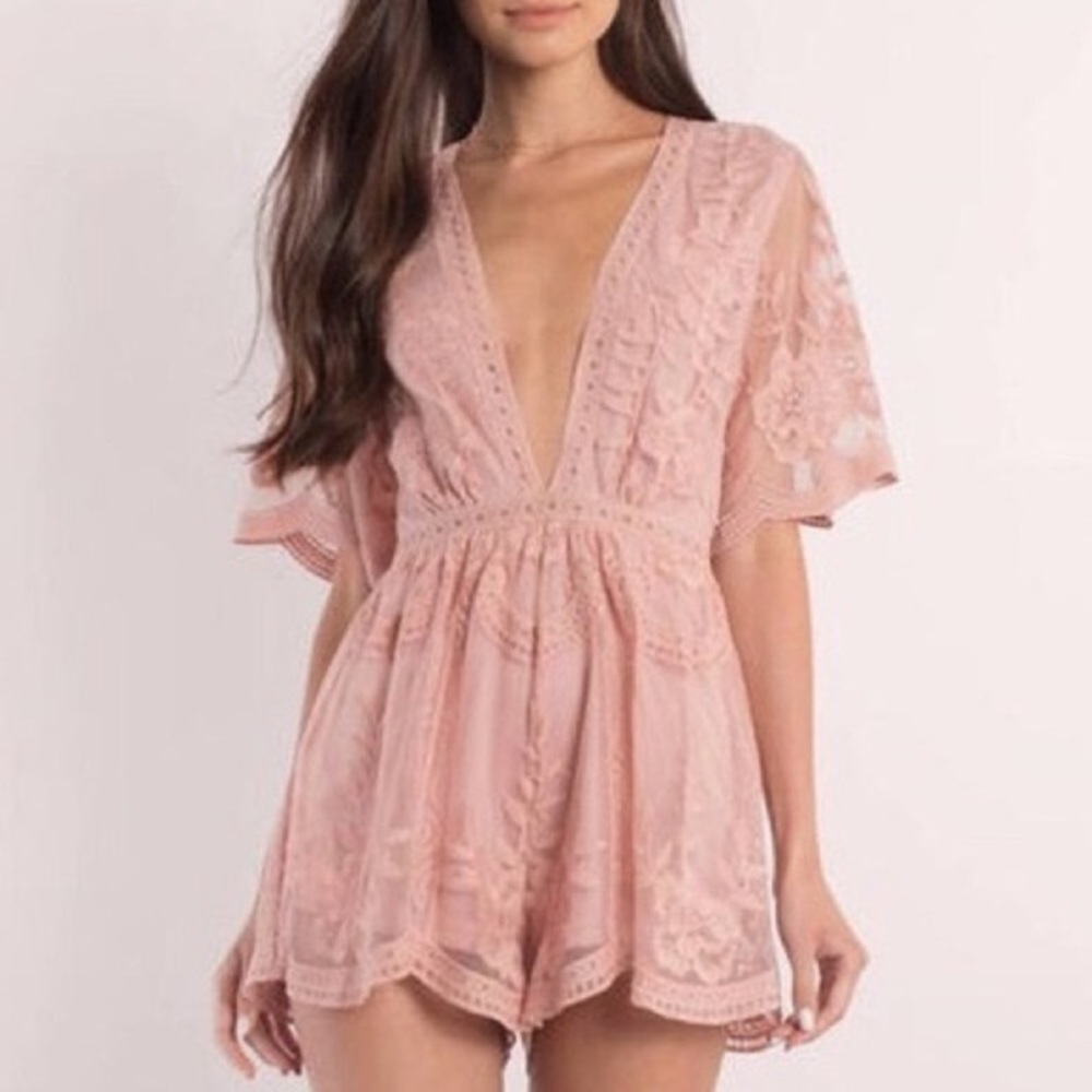 Bohemian inspired embroidered mesh lace romper. Deep V-neckline. Small